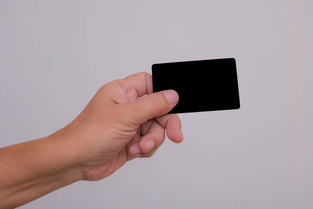 Ruka drží prázdnou kartu přes bílé pozadí - Fotografie, Obrázek