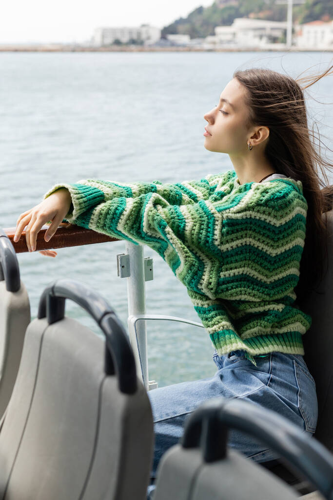 Side view of young woman looking at sea during cruise on yacht in Turkey  - Photo, Image