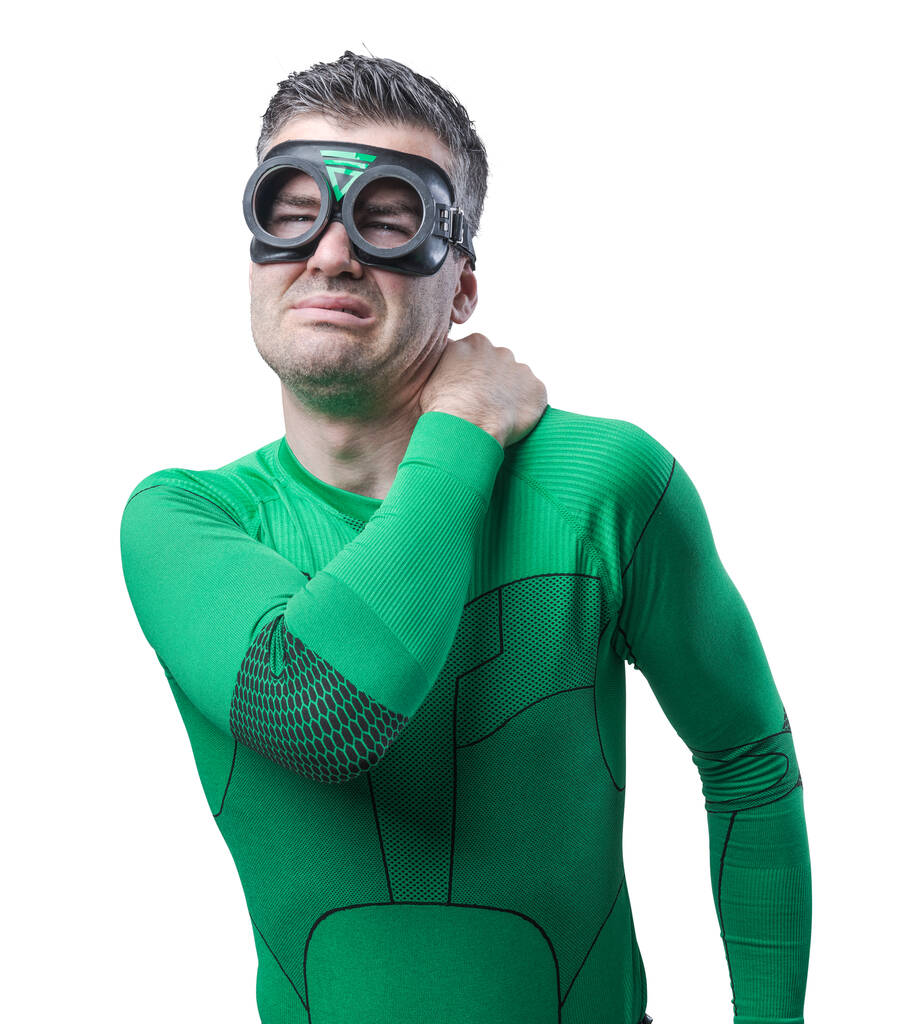 groene superheld raken zijn nek en schouder en gevoel pijn. - Foto, afbeelding
