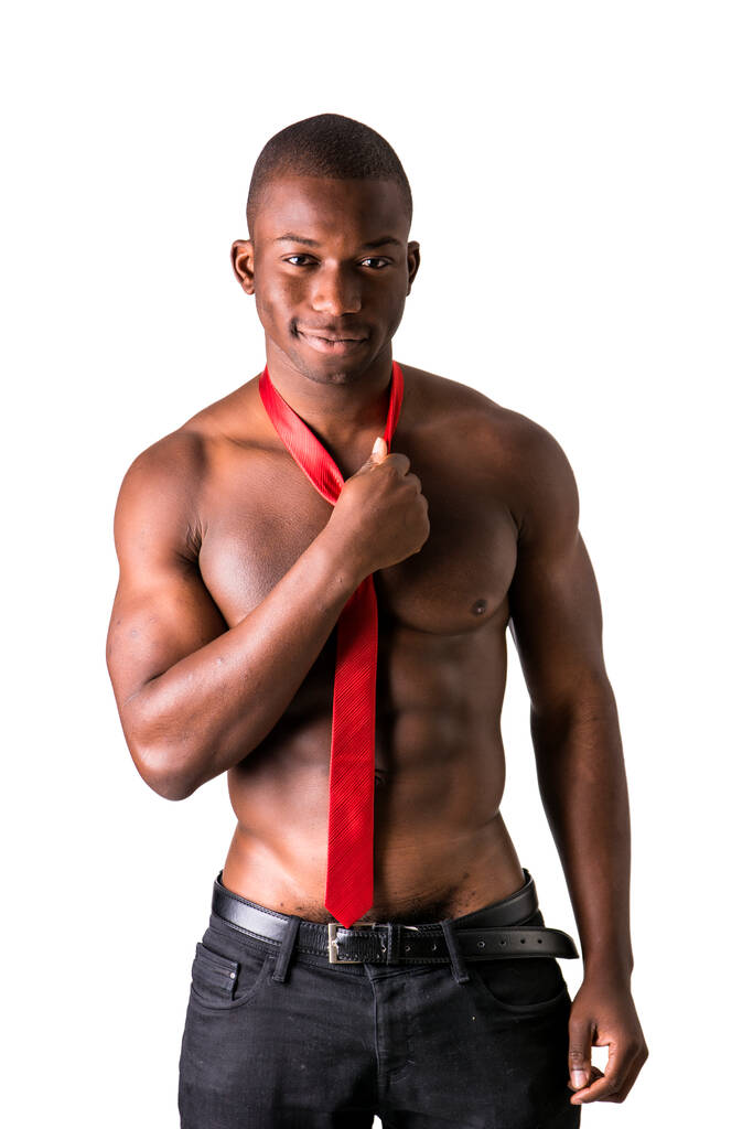 Attractive black young muscle man naked, wearing only pants and red necktie, isolated on white - Photo, Image