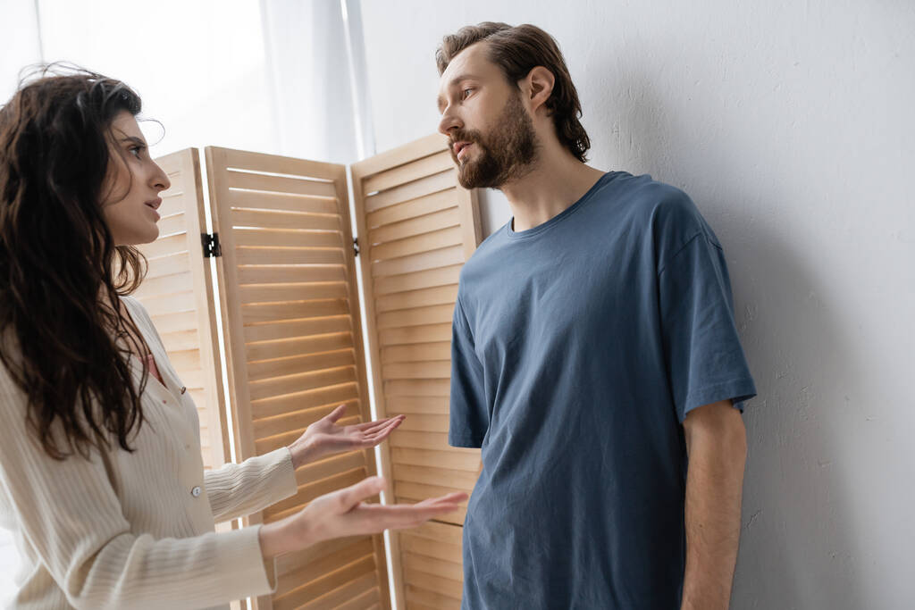 Angry woman talking to boyfriend during relationship crisis at home  - Photo, Image