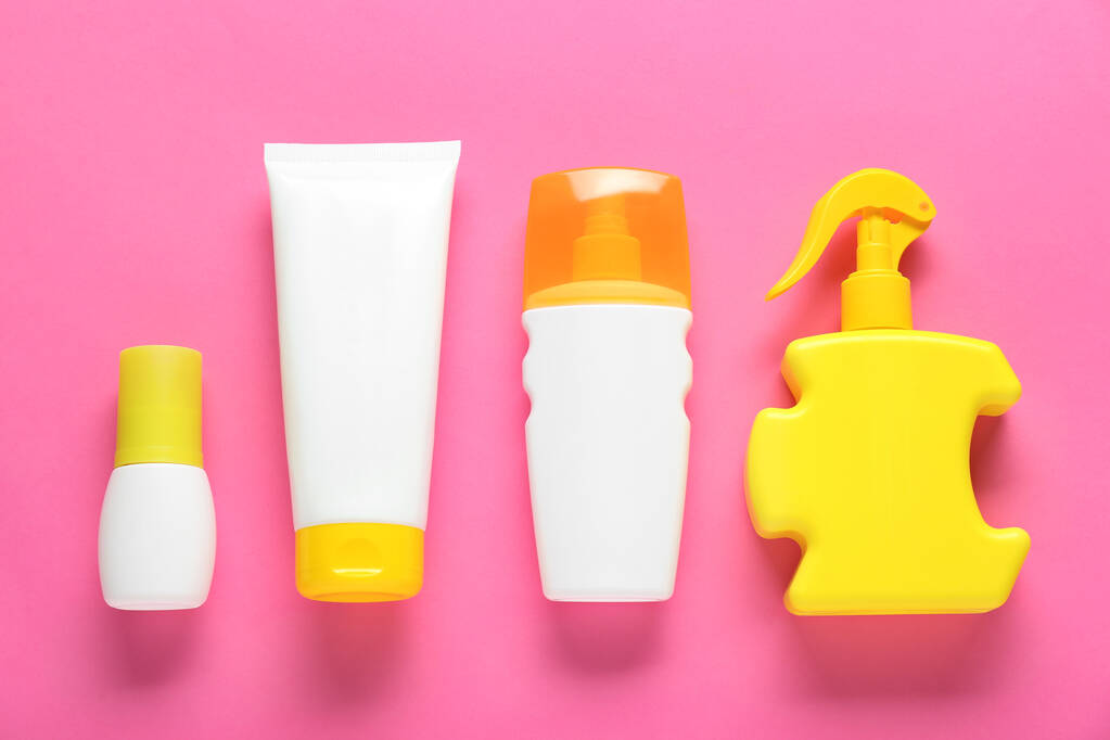 Suntan products on pink background, flat lay - Photo, Image