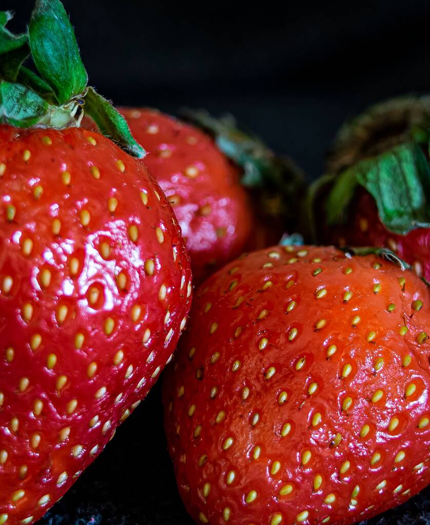 A vertical shot of red strawberries on the blurry background - Photo, Image