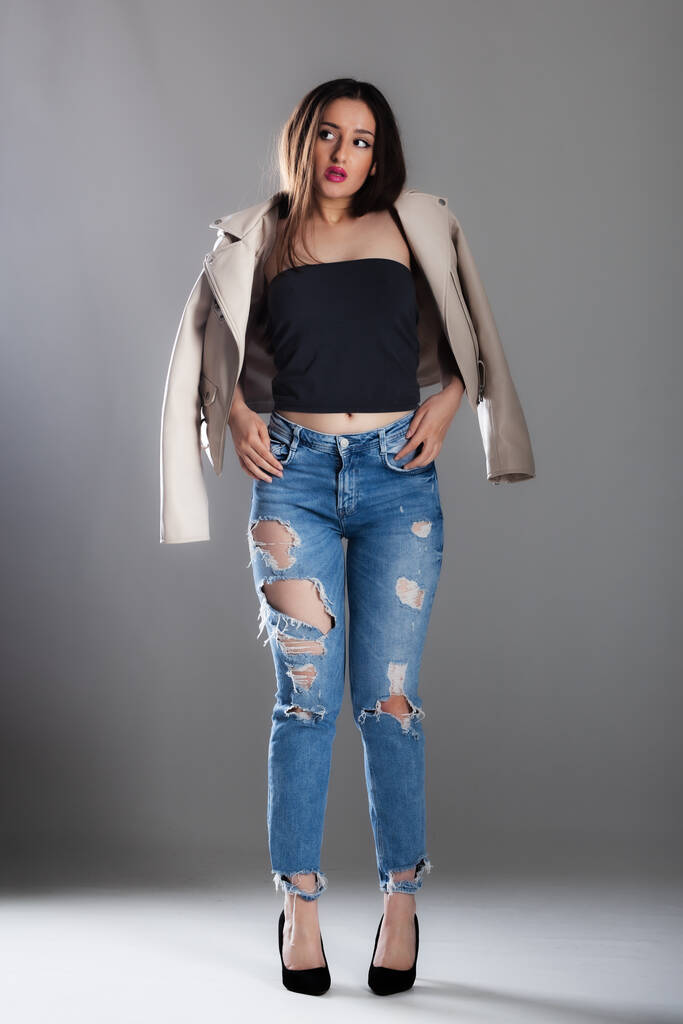 full body poirtrait of a beautiful girl with long hair wearing jeans and jacket - Photo, Image