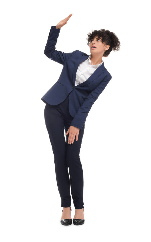 Beautiful young businesswoman in suit on white background - Photo, Image