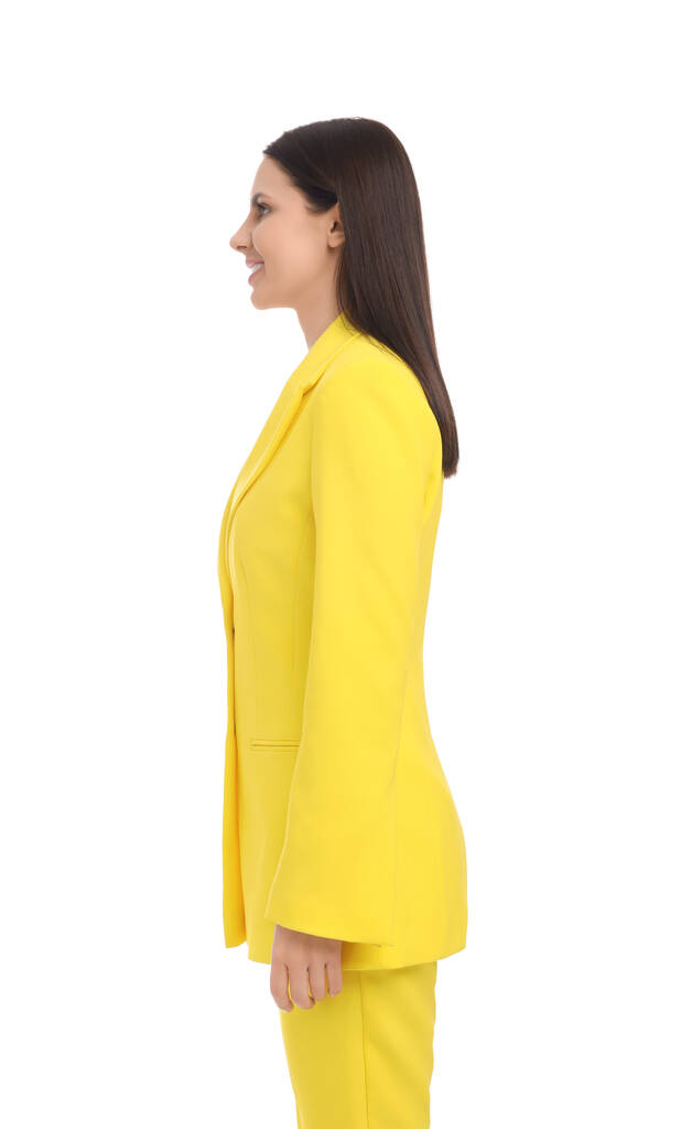 Επιχειρηματίας με κίτρινο κοστούμι στέκεται σε λευκό φόντο - Φωτογραφία, εικόνα