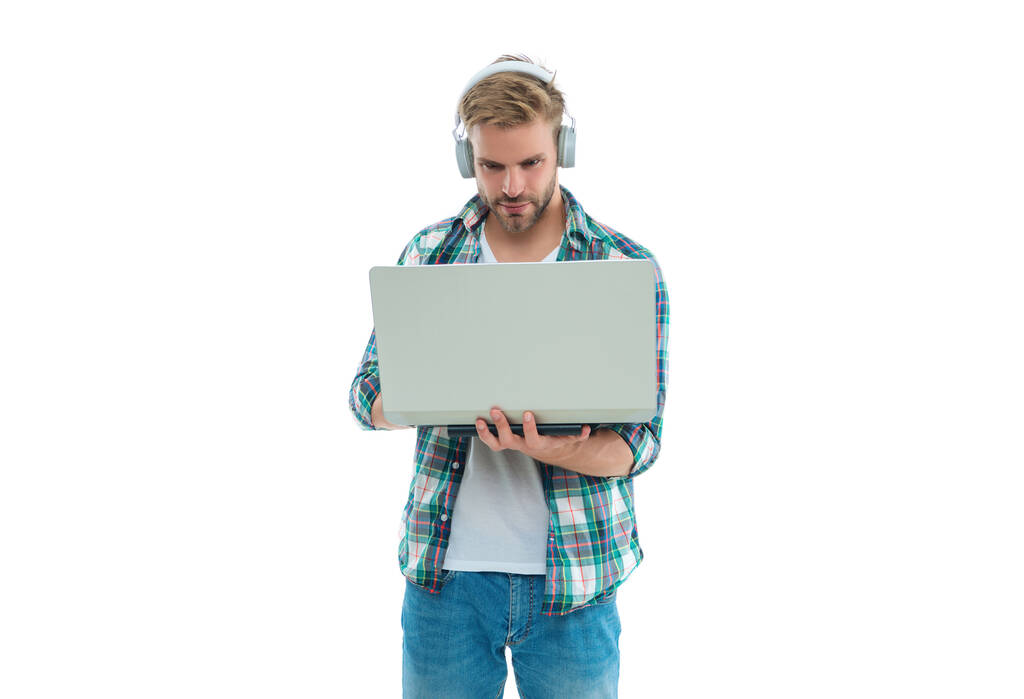 photo of millennial man blogger with laptop. millennial man blogger isolated on white. millennial man blogger on background. millennial man blogger in studio. - Photo, Image
