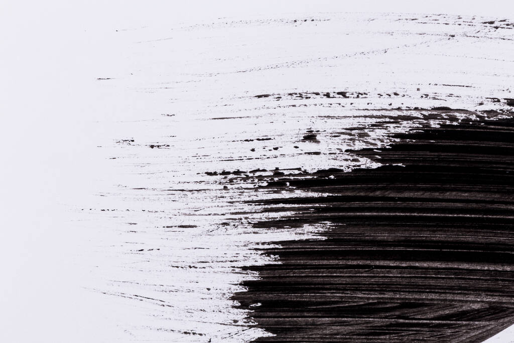 Tinta preta isolada sobre fundo de papel branco
 - Foto, Imagem