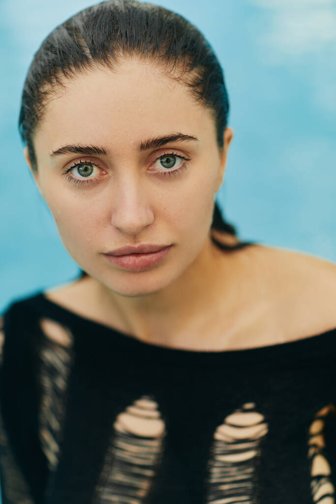 close up, natural beauty, no makeup look, sexy brunette woman in black knitted outfit posing inside of outdoor swimming pool during vacation in Miami, looking at camera, portrait  - Photo, Image