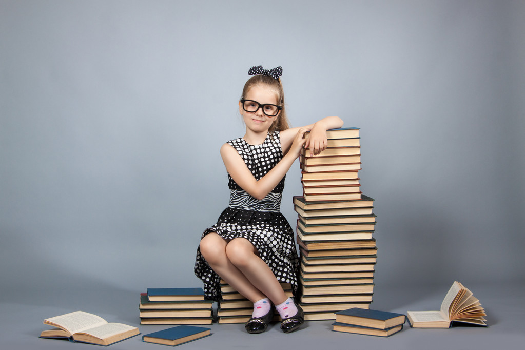 smart girl with a stack of books. - Photo, Image