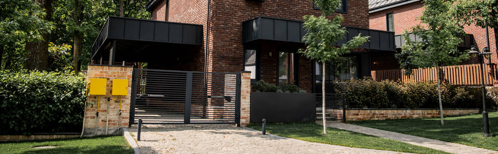 contemporary city cottage, brick walls, metal gates, real estate market, banner - Photo, Image