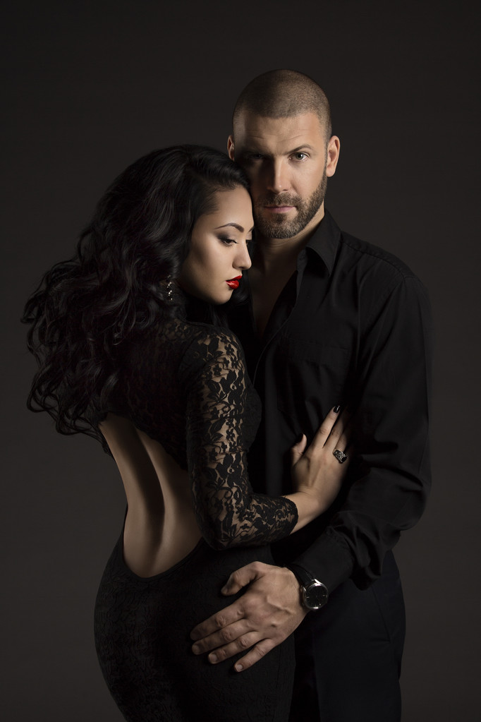 Couple Man and Woman in Love, Fashion Beauty Portrait of Models Embracing over Black Background - Photo, Image