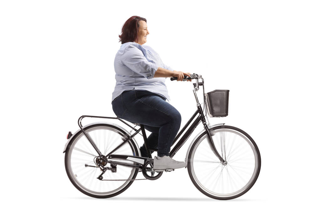 白い背景に分離された自転車の肥満女性 - 写真・画像