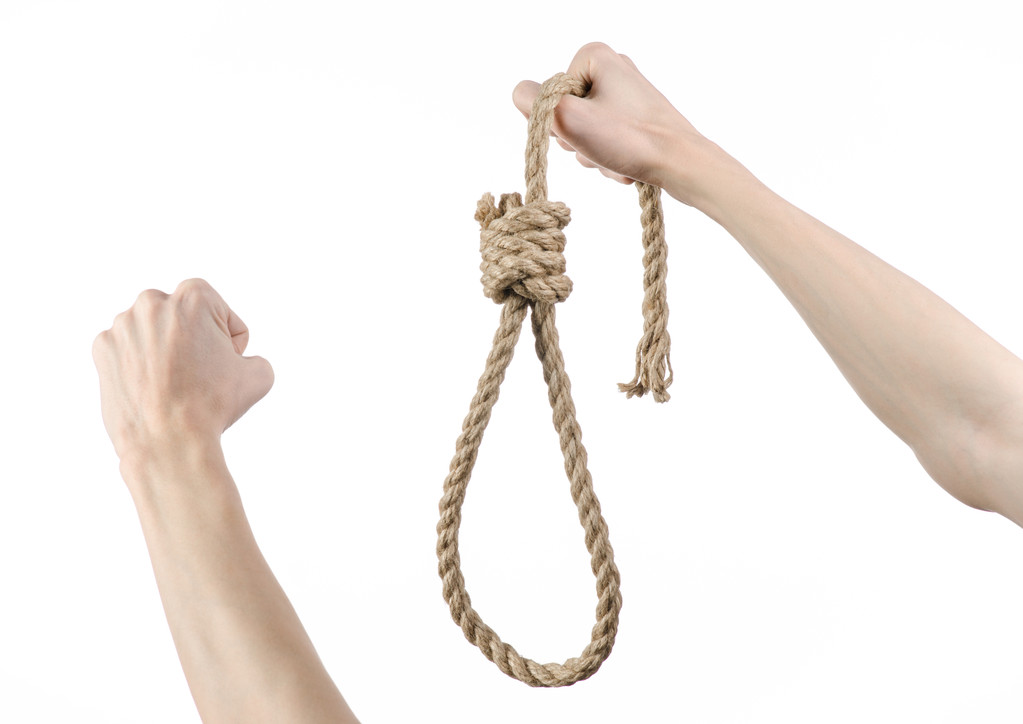 リンチと自殺のテーマ: 人間の手に掛かっている白いロープのループ孤立の背景 - 写真・画像