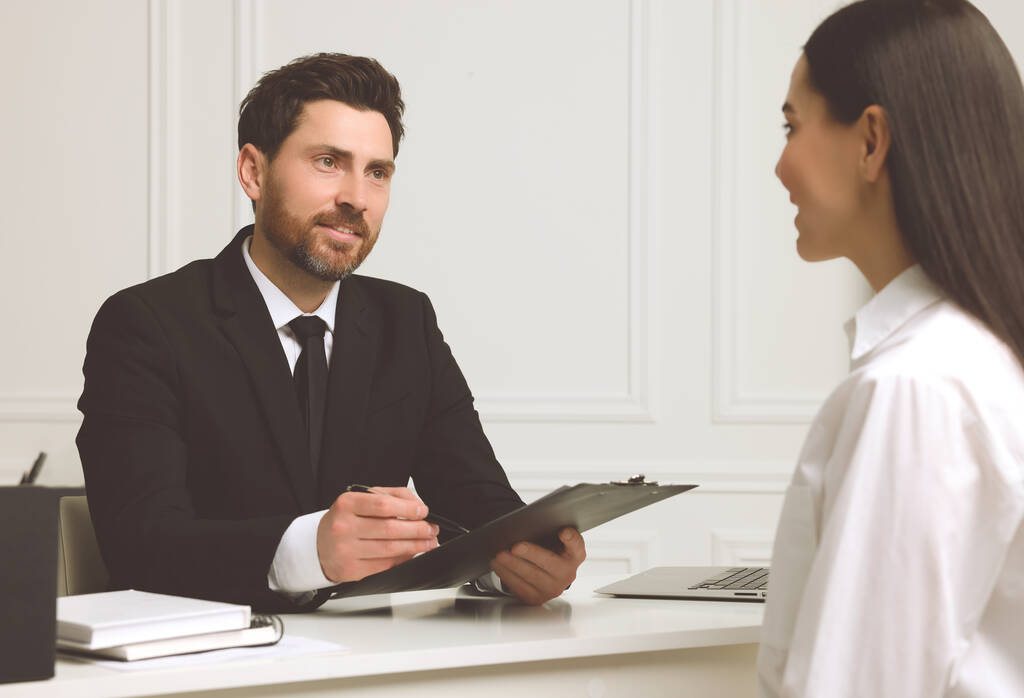 Human resources manager conducting job interview with applicant in office - Photo, Image