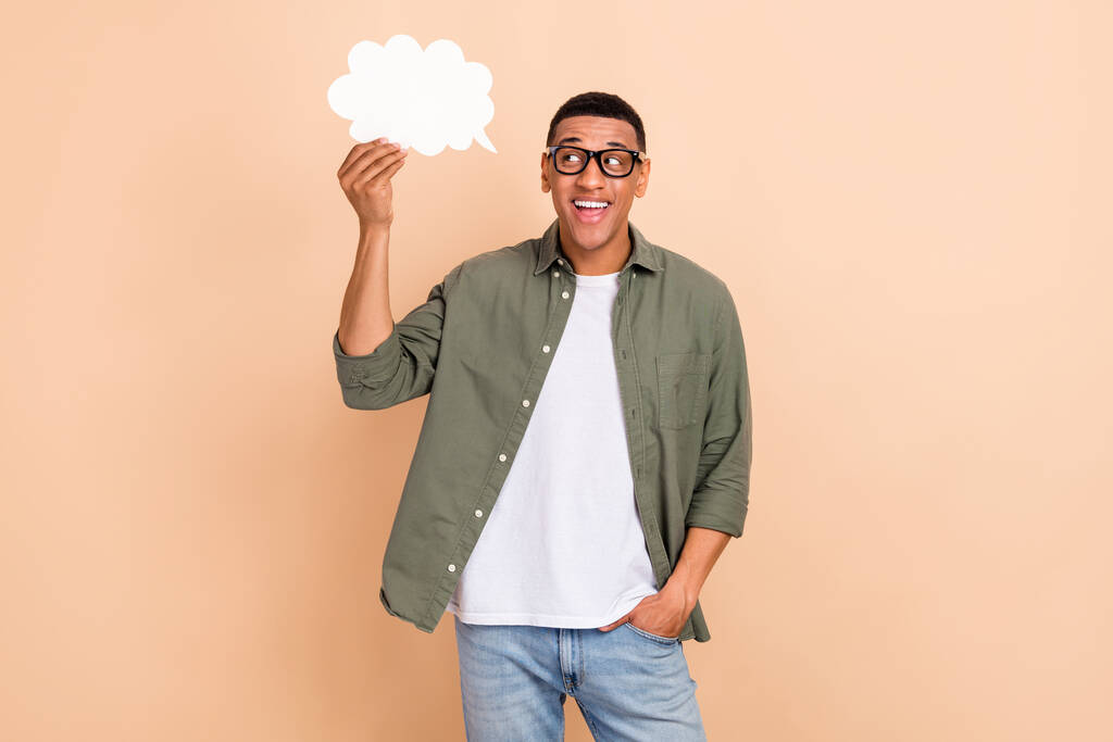 Portrait of optimistic friendly man wear stylish shirt eyewear look at empty space in mind cloud isolated on beige color background. - Photo, Image