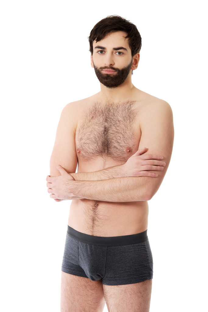 Homme torse nu avec les bras croisés
. - Photo, image