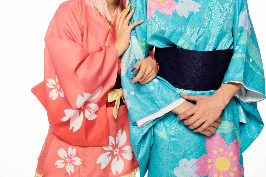 cropped view of anime couple in bright and elegant kimonos on white, japanese cosplay subculture - Photo, Image