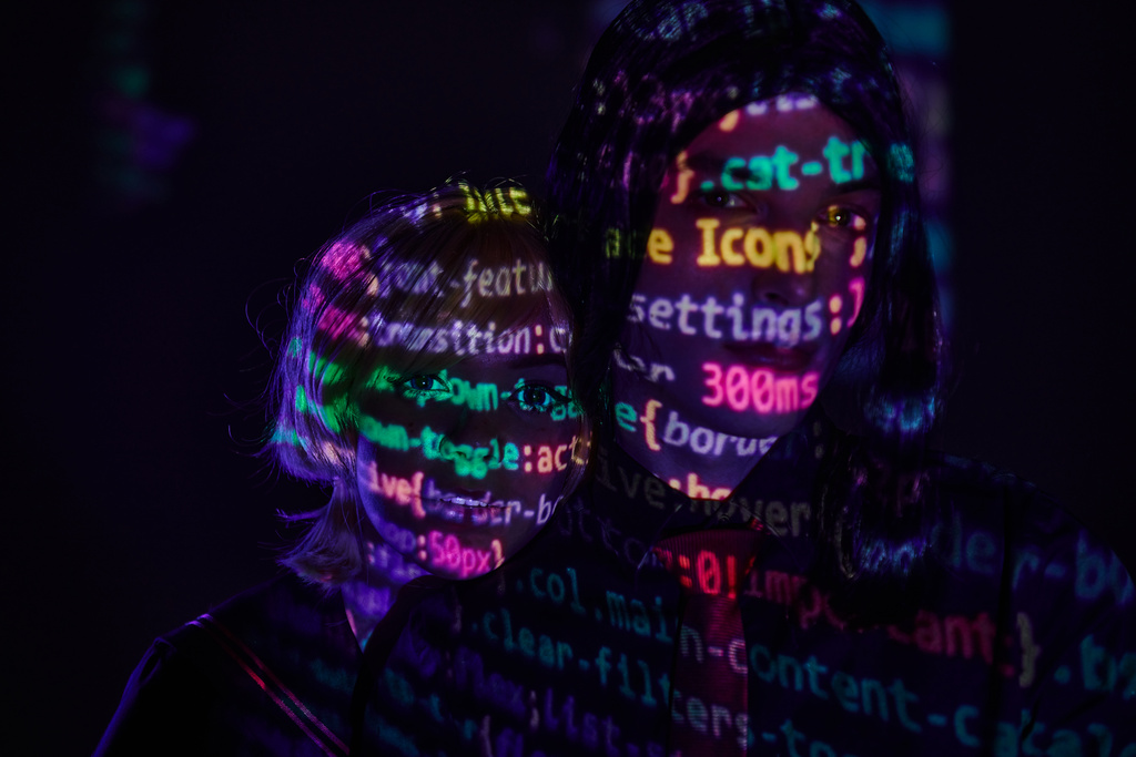 portrait of futuristic couple with neon programming lettering on dark backdrop, cosplay concept - Photo, Image