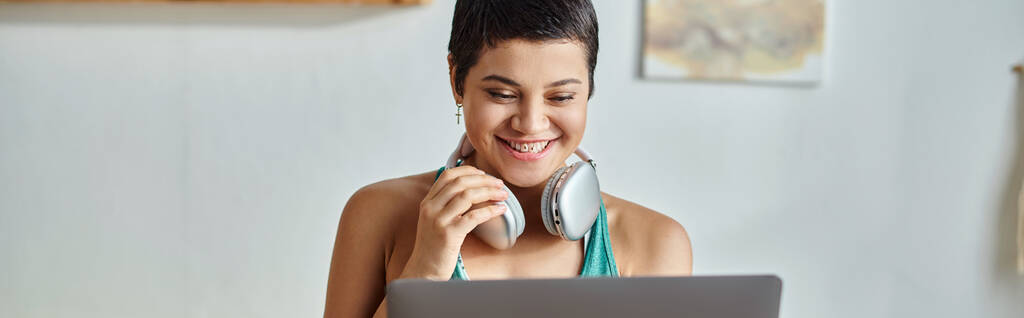 cheerful woman attending online fitness lesson smiling at camera, fitness and sport, banner - Photo, Image
