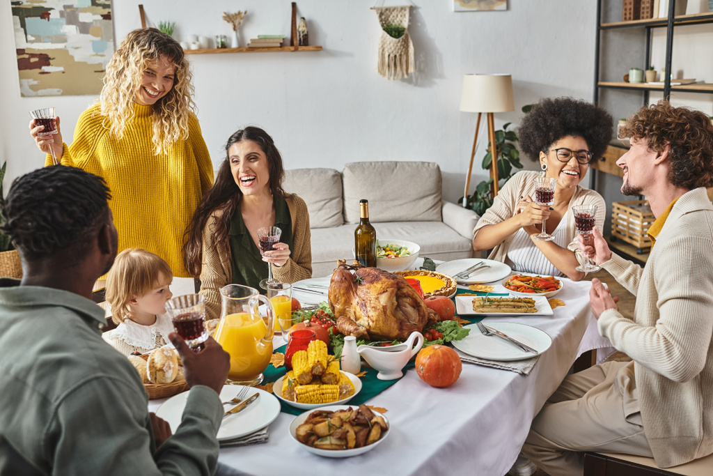 multiethnic friends and family celebrating Thanksgiving with toddler baby girl, quality time - Photo, Image