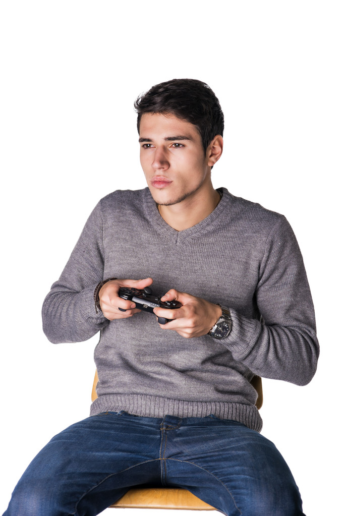 Молодой человек использует джойстик или джойстик для видеоигр
 - Фото, изображение