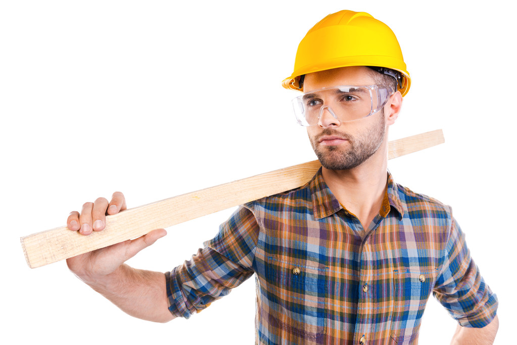 Carpenter in hardhat and protective eyewear - Photo, Image