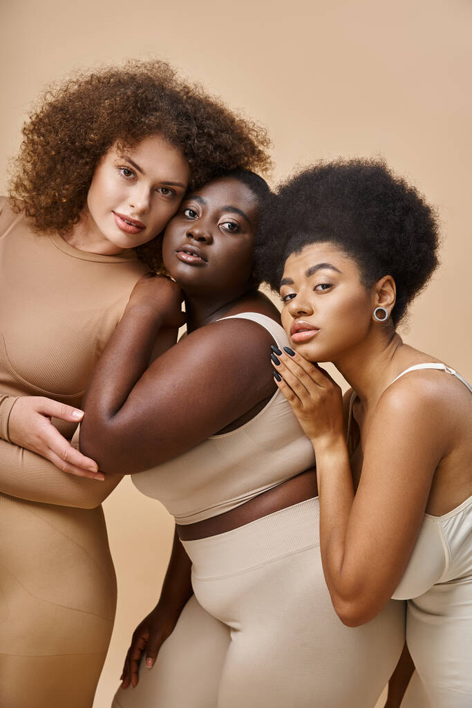 diverse multiracial body positive women in underwear smiling on beige backdrop, plus size beauty - Photo, Image