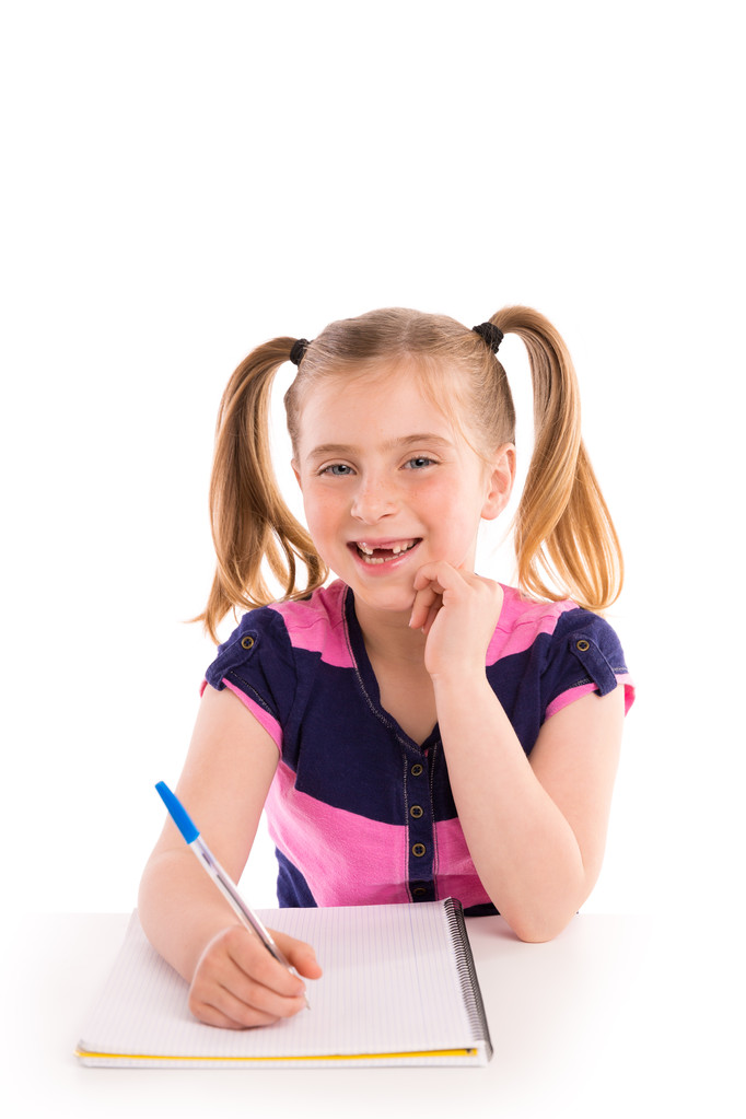 Blond kid girl student with spiral notebook in desk - Photo, Image