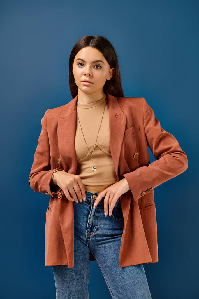 good looking adorable teenage girl in fashionable brown blazer posing and looking at camera - Photo, Image
