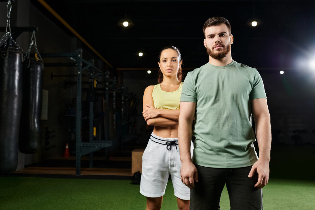 A male trainer and a woman in a gym, focusing on posture and technique. - Photo, Image