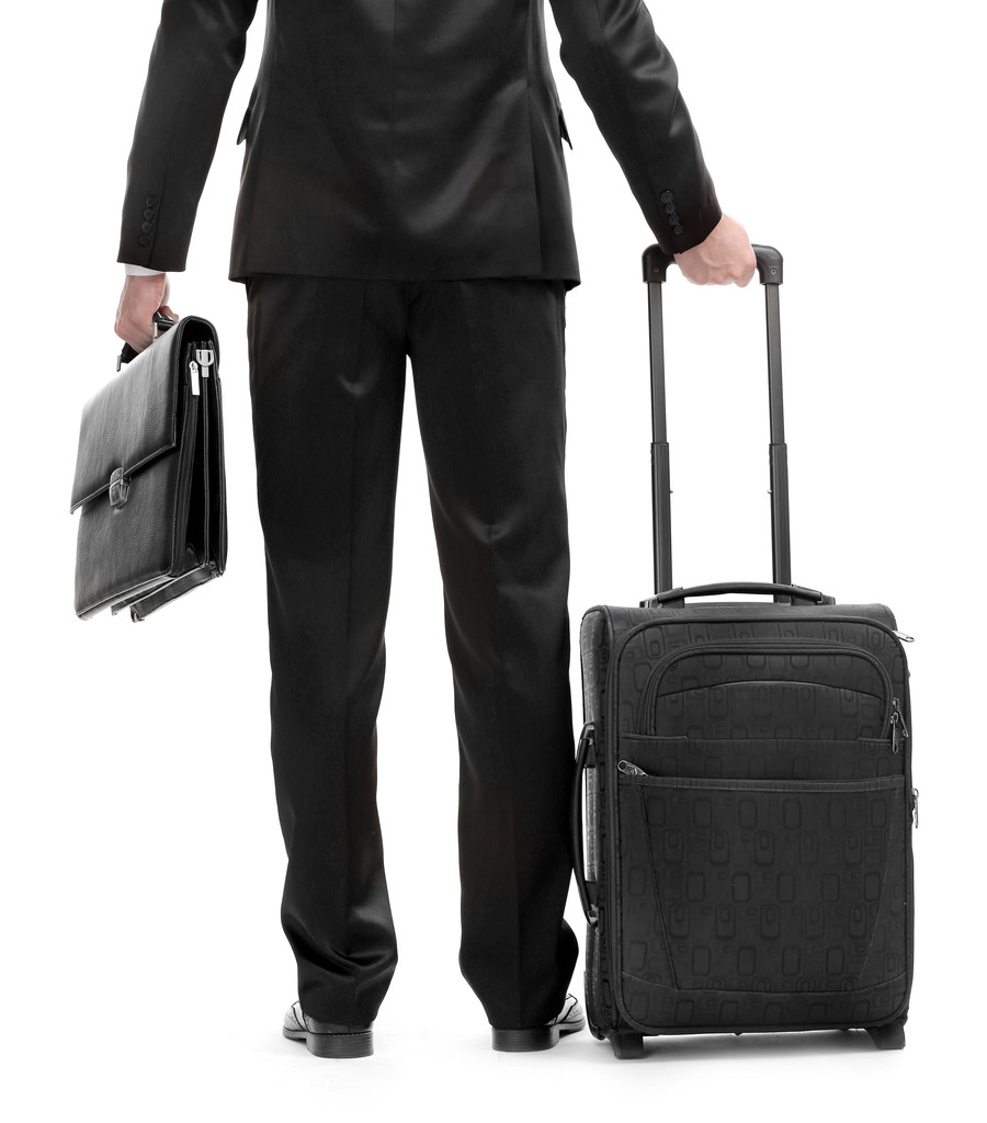 Елегантний чоловік у костюмі з валізою та портфелем ізольований на білому
 - Фото, зображення