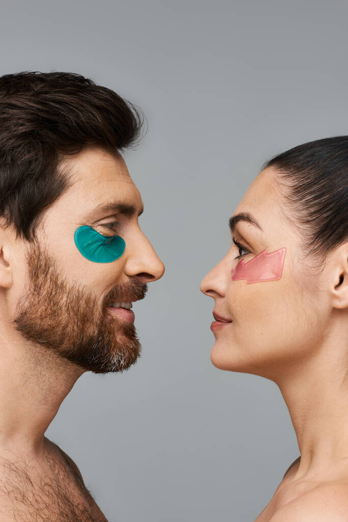 Attractive man and a woman using eye patches. - Photo, Image
