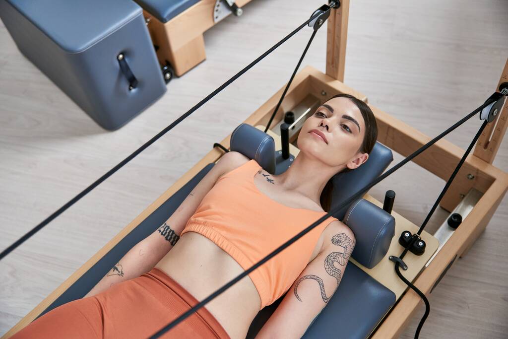 Alluring woman on a pilates lesson. - Photo, Image