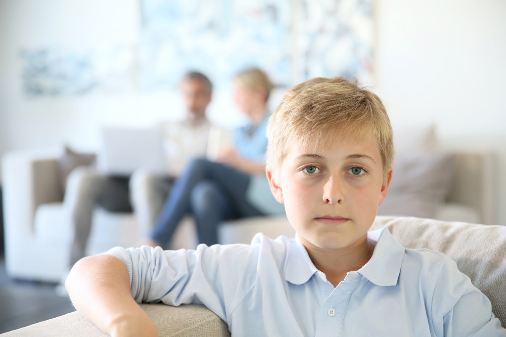 Boy sitting on couch - Photo, Image