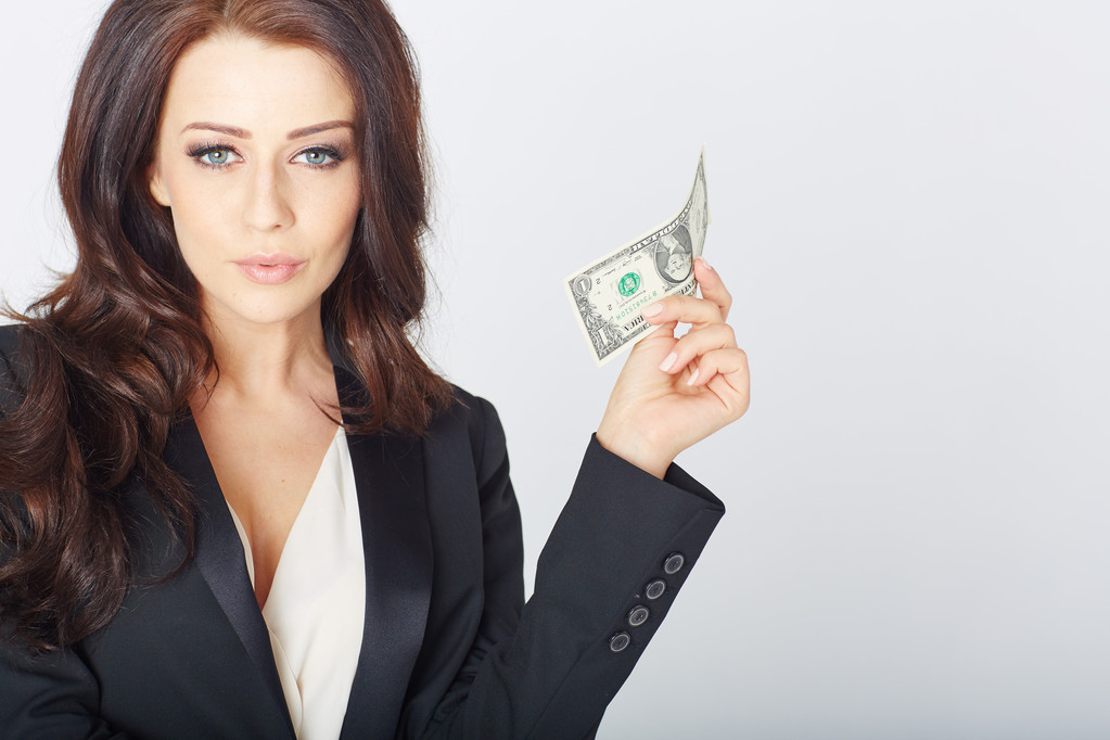 Jeune femme d'affaires avec un dollar en main
 - Photo, image
