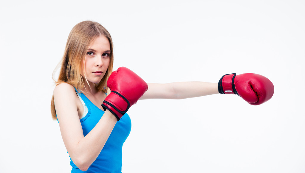 Молодая женщина в боксёрских перчатках  - Фото, изображение