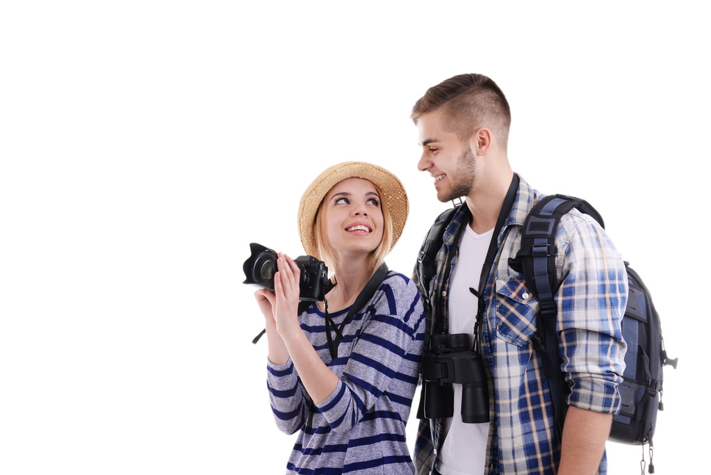 Ζεύγος των ταξιδιωτών με κάμερα που απομονώνονται σε λευκό - Φωτογραφία, εικόνα