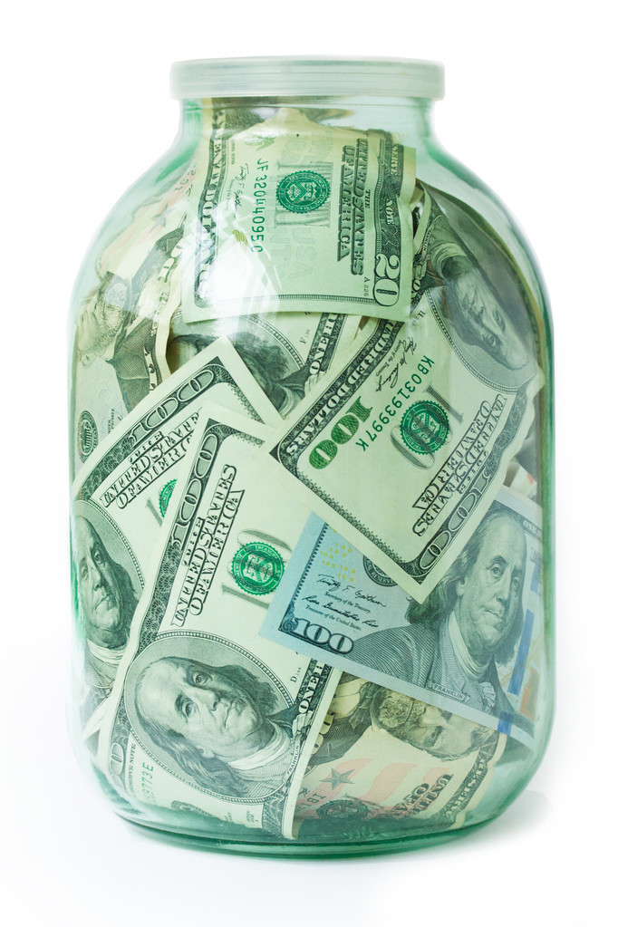 долари в скляній банці ізольовані на білому тлі
 - Фото, зображення