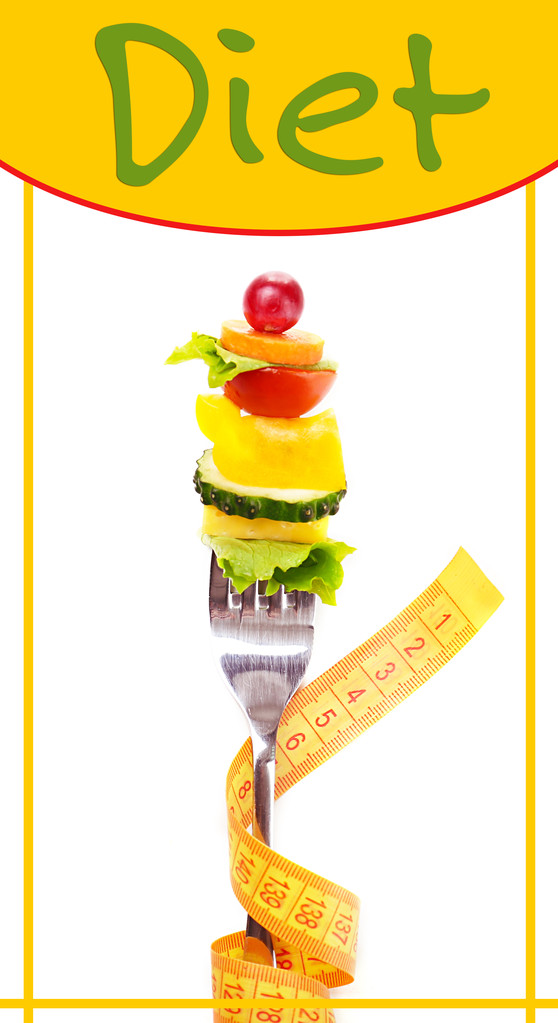 Snack de verduras en tenedor con cinta métrica
 - Foto, imagen