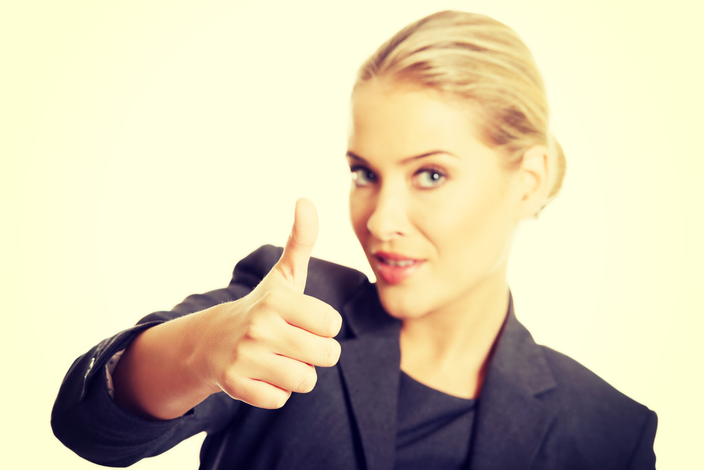 Businesswoman with thumbs up gesture - Photo, Image