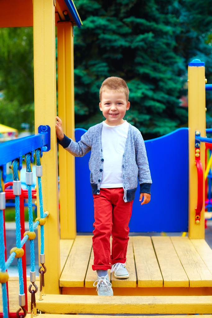 portrait of cute little baby boy on playground - 写真・画像