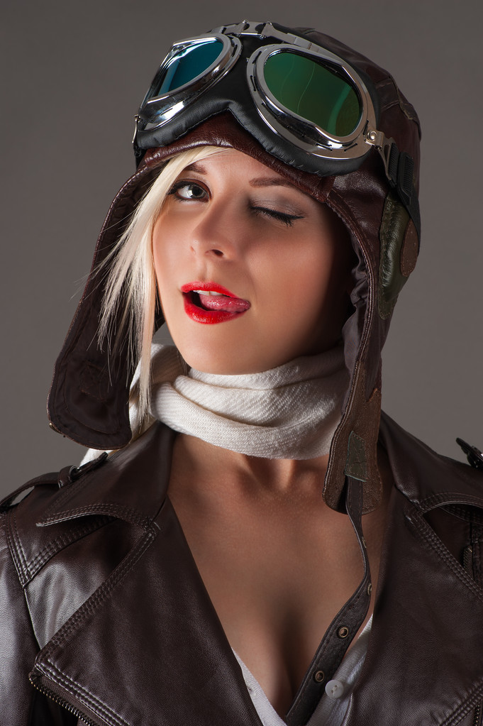 woman in aviator helmet winks and licking lips - Fotografie, Obrázek