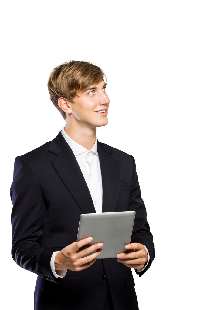 Young businessman in suit with a tablet pc on his hand, looking - Photo, Image
