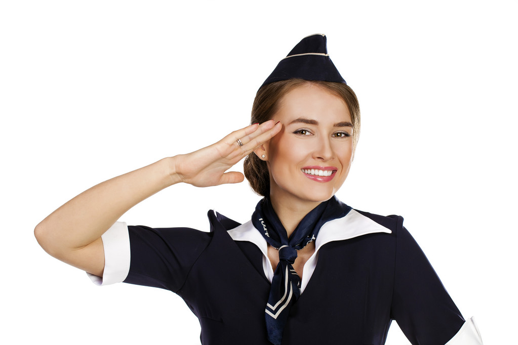 piękna, uśmiechnięta stewardesa na białym tle na białym tle - Zdjęcie, obraz