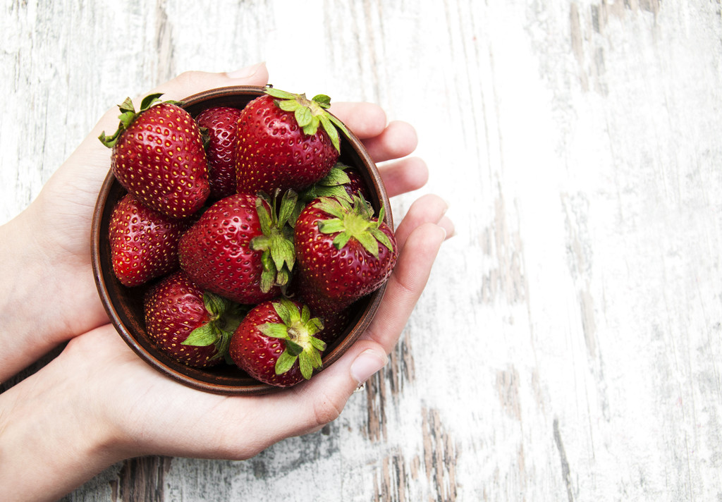 strawberry in bowl with hands - Photo, Image
