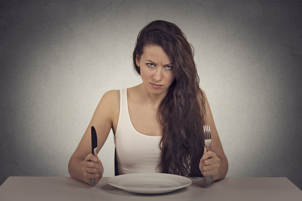 skeptical dieting woman tired of diet restrictions looking frustrated - 写真・画像