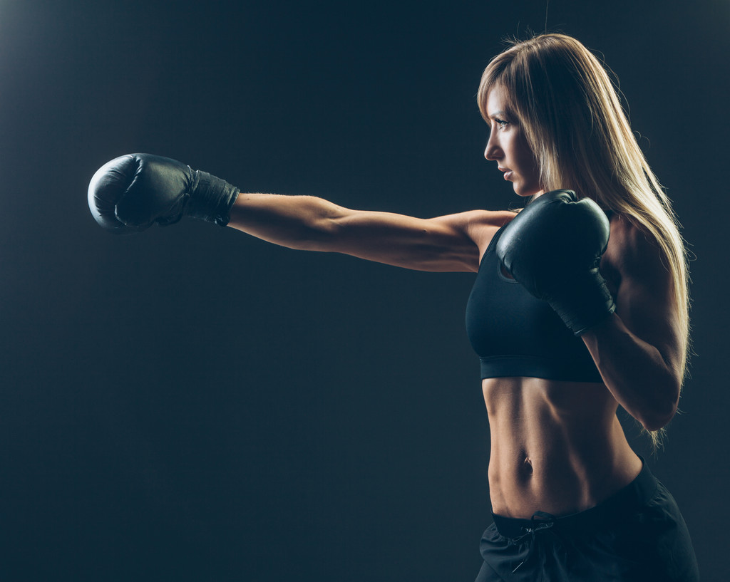 beautiful woman with the red boxing gloves,black background - Photo, Image