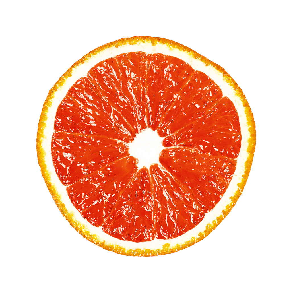 Половина грейпфрута на білому тлі
 - Фото, зображення