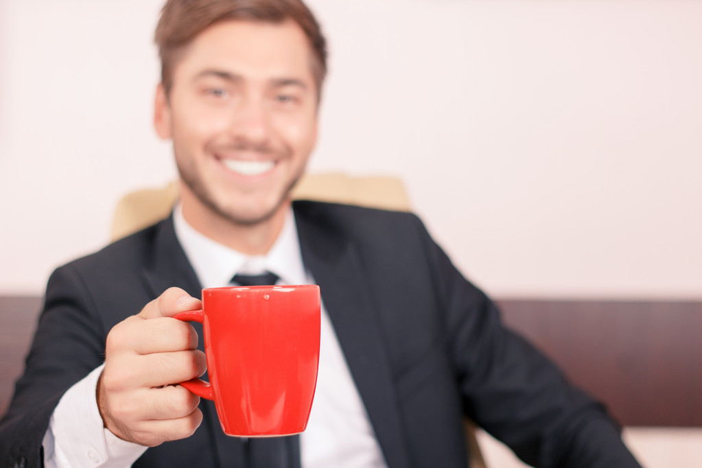 Smiling lawyer drinking tea  - Foto, afbeelding